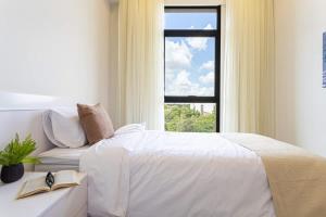 Letto o letti in una camera di Hestia at Asuncion Cozy Bright & Smart 2BDR