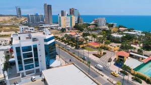 an aerial view of a city with a street at Navio Hotel in Manta