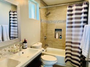 a bathroom with a sink and a toilet and a shower at Beautiful Stay in Moreno Valley - Close to parks in Moreno Valley +8 photos