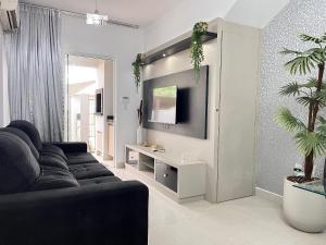 Μια τηλεόραση ή/και κέντρο ψυχαγωγίας στο Edifício Residencial | 250m da Praia