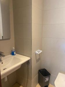 a bathroom with a sink and a mirror at Charmant appartement à Anfa in Casablanca +11 photos