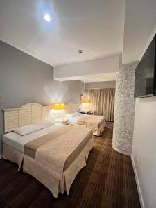 Postel nebo postele na pokoji v ubytování Hotel Roraima Inn