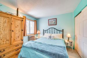 a bedroom with a bed with blue walls at Resort-Style Amenities at Home Near Campton Mtn! in Campton +18 photos