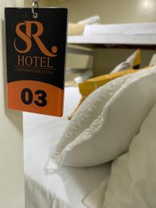 Cama ou camas em um quarto em Sr Hotel