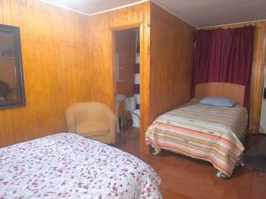 En eller flere senger på et rom på CalafateMichay