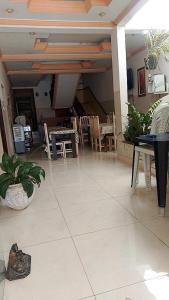 a living room with a table and chairs at Oeste Lapa Hotel in Bom Jesus da Lapa