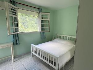 Ένα ή περισσότερα κρεβάτια σε δωμάτιο στο Appartement proche de la mer