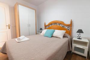 a bedroom with a large bed with a wooden headboard at Cortijo Pinar 2 in Níjar +61 photos