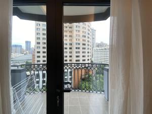 a balcony with a view of a building at Tyms APT Hengshan RD Near IAPM K11 Line9 in Shanghai