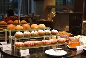 a display of breads and pastries in a bakery at Millennium Hotel Chengdu in Chengdu