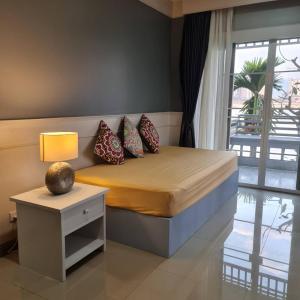 โรงแรม ริเวอร์บรีซ เชียงแสน River Breeze Chiangsean客房内的一张或多张床位
