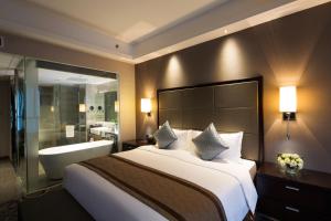 Letto o letti in una camera di Millennium Hotel Fuqing