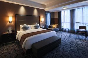 Letto o letti in una camera di Millennium Hotel Fuqing