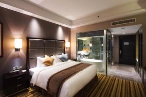 Letto o letti in una camera di Millennium Hotel Fuqing