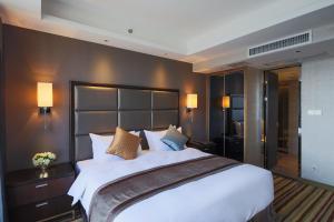 Letto o letti in una camera di Millennium Hotel Fuqing