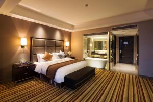 Letto o letti in una camera di Millennium Hotel Fuqing