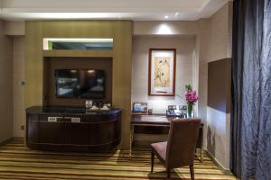 TV o dispositivi per l'intrattenimento presso Millennium Hotel Fuqing