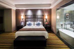 Letto o letti in una camera di Millennium Hotel Fuqing