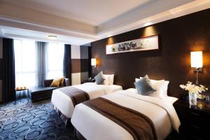 Letto o letti in una camera di Millennium Hotel Fuqing