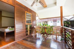 a dining room with a table and chairs at Ruentara Resort & Villa in Buriram