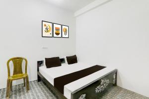 Postel nebo postele na pokoji v ubytování HOTEL O SHYAM