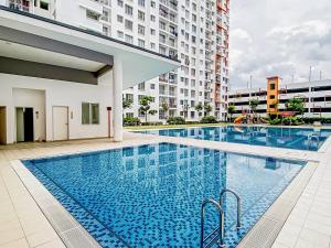 a large swimming pool in the middle of a building at StayD'Cassia Homestay Semenyih in Semenyih