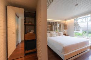 Postel nebo postele na pokoji v ubytování Hotel Lumi Gili Trawangan