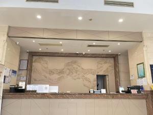a large wall with a drawing of a woman at Clivia Hotel in Shanghai