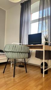 TV a/nebo společenská místnost v ubytování Etage1