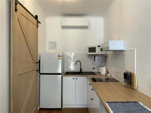 Kuchyň nebo kuchyňský kout v ubytování Taft Apartments
