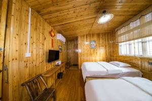 Кровать или кровати в номере Xiangzixi Bed and Breakfast