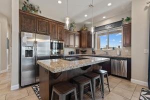 a kitchen with wooden cabinets and stainless steel appliances at Sunset on the 5th in Washington