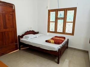 Postel nebo postele na pokoji v ubytování Milu Homes + 6 fotografií