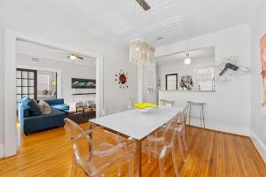 a dining room and living room with a table and chairs at Vibrant and Cozy 2BR near Uptown with Balcony in Charlotte