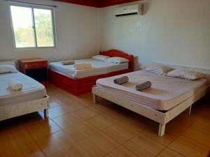 Katil atau katil-katil dalam bilik di Smylen Homestay