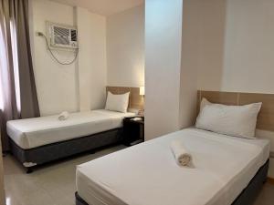 Voodi või voodid majutusasutuse Soi Suites toas