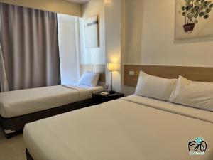 Voodi või voodid majutusasutuse Soi Suites toas