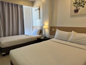 Voodi või voodid majutusasutuse Soi Suites toas