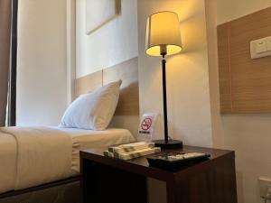 Voodi või voodid majutusasutuse Soi Suites toas