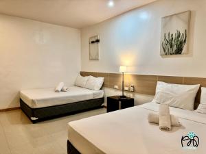 Voodi või voodid majutusasutuse Soi Suites toas