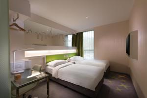 Cama o camas de una habitación en Dorsett Tsuen Wan, Hong Kong