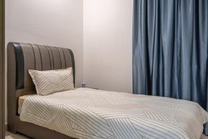 Un ou plusieurs lits dans un hébergement de l'établissement The White House - 3BR Meridin Bayvue