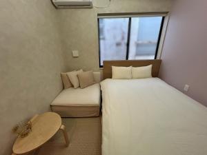 Ein Bett oder Betten in einem Zimmer der Unterkunft SANDBoX