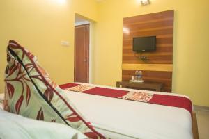 Postel nebo postele na pokoji v ubytování Hotel O Gitanjali Inn
