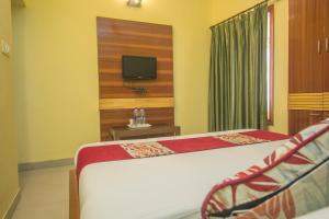 TV a/nebo společenská místnost v ubytování Hotel O Gitanjali Inn