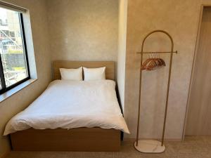Ein Bett oder Betten in einem Zimmer der Unterkunft SANDBoX