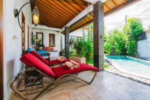 a villa with a pool and a hammock on a patio at Villa Moringa 2 - Private Villa in the Heart of Canggu, 5 Minutes from the Beach in Canggu
