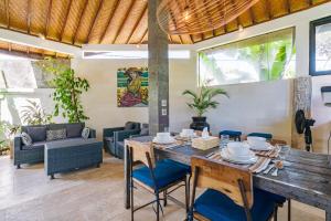 a dining room with a table and chairs at Villa Moringa 2 - Private Villa in the Heart of Canggu, 5 Minutes from the Beach in Canggu