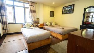 Voodi või voodid majutusasutuse Hotel Shree Tara toas