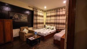 Voodi või voodid majutusasutuse Hotel Shree Tara toas